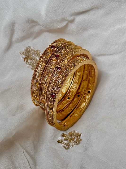 Floral craftings on yellow gold bangles