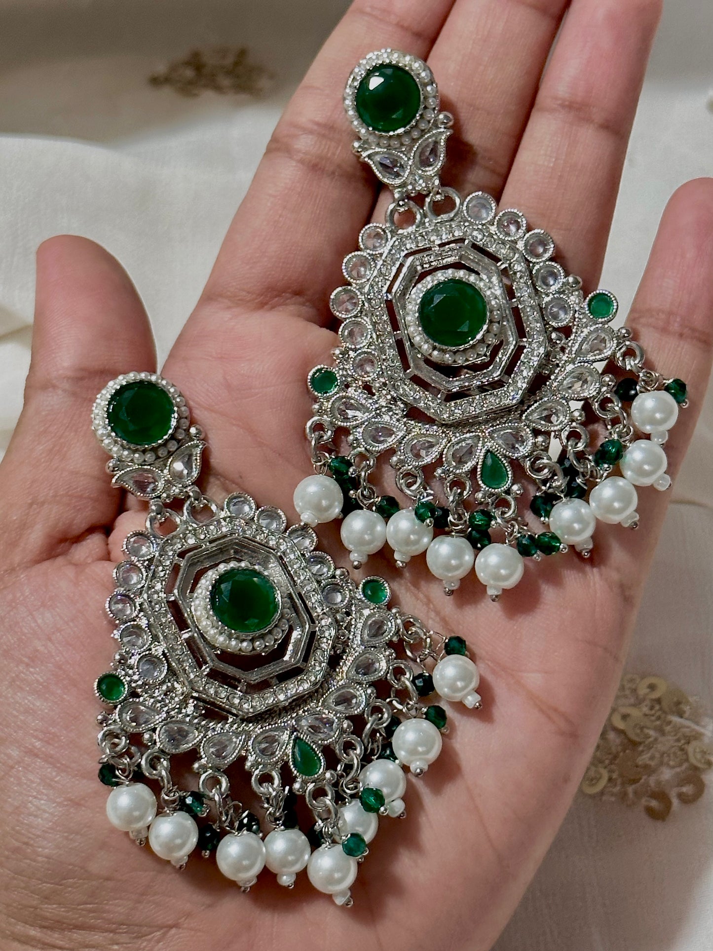 Emerald diamond cut silver earrings