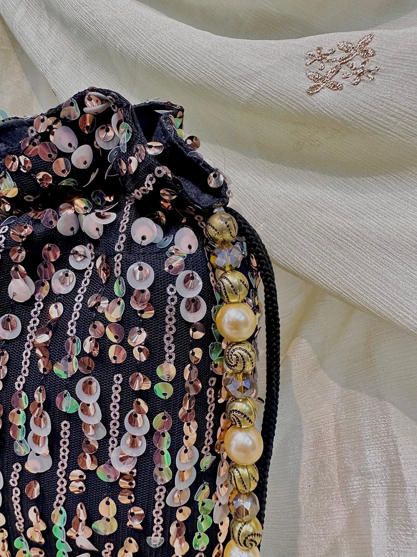 Shades of brown sequins potli